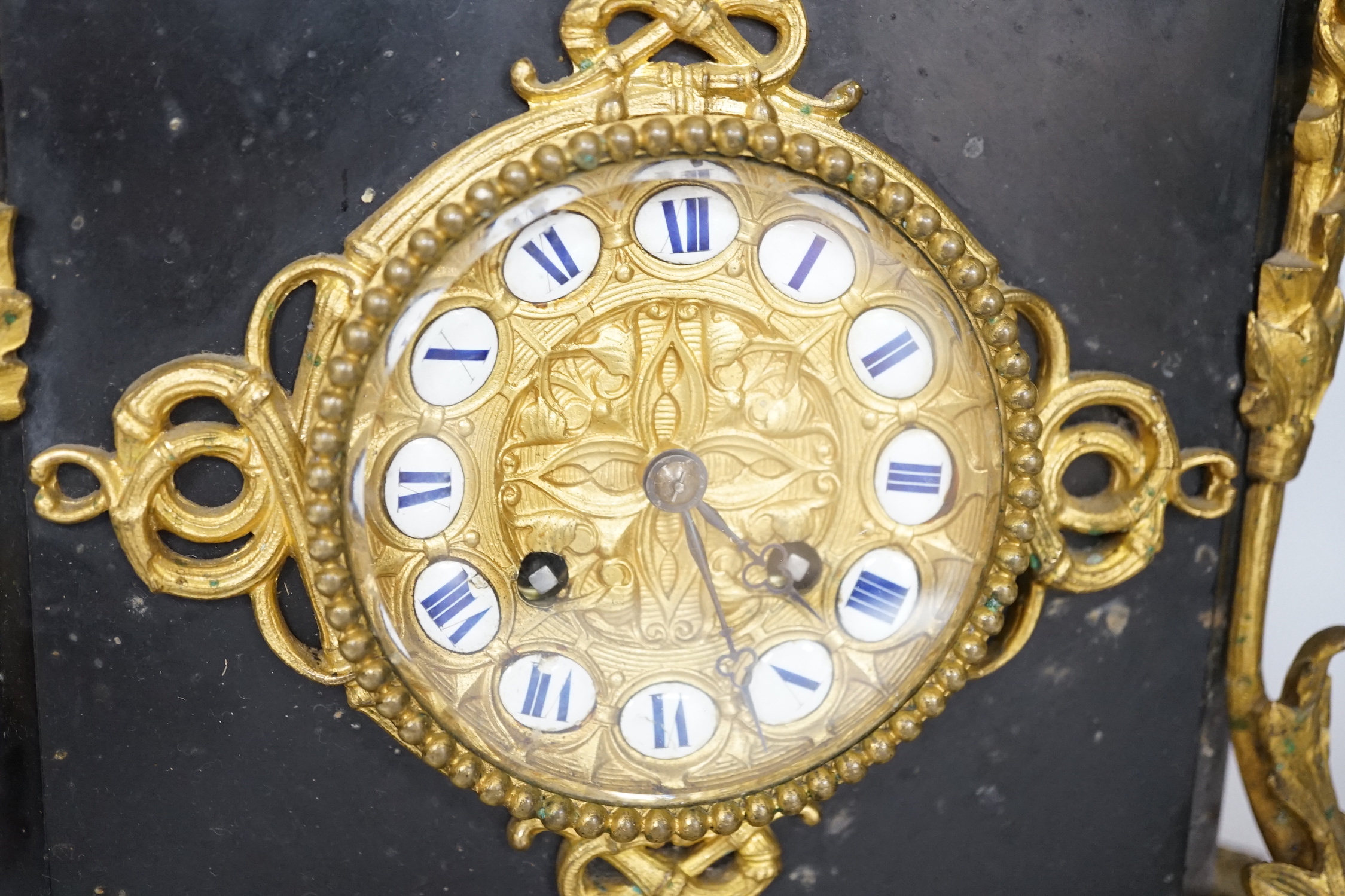 An early 20th century gilt-metal mounted mantel clock with bacchanalian group surmount, 44cm
